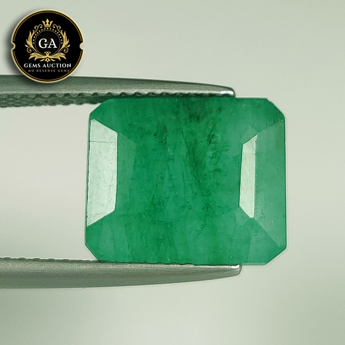 7.69 Ct Natural Green Emerald Octagon Cut: Weight - 7.69 Ct / Size - 12.00 x 10.00 x 6.60 mm / Shape - Octagon Cut / Color - Green / Clarity - SI / Origin - Zambia / Treatment - Color Coated