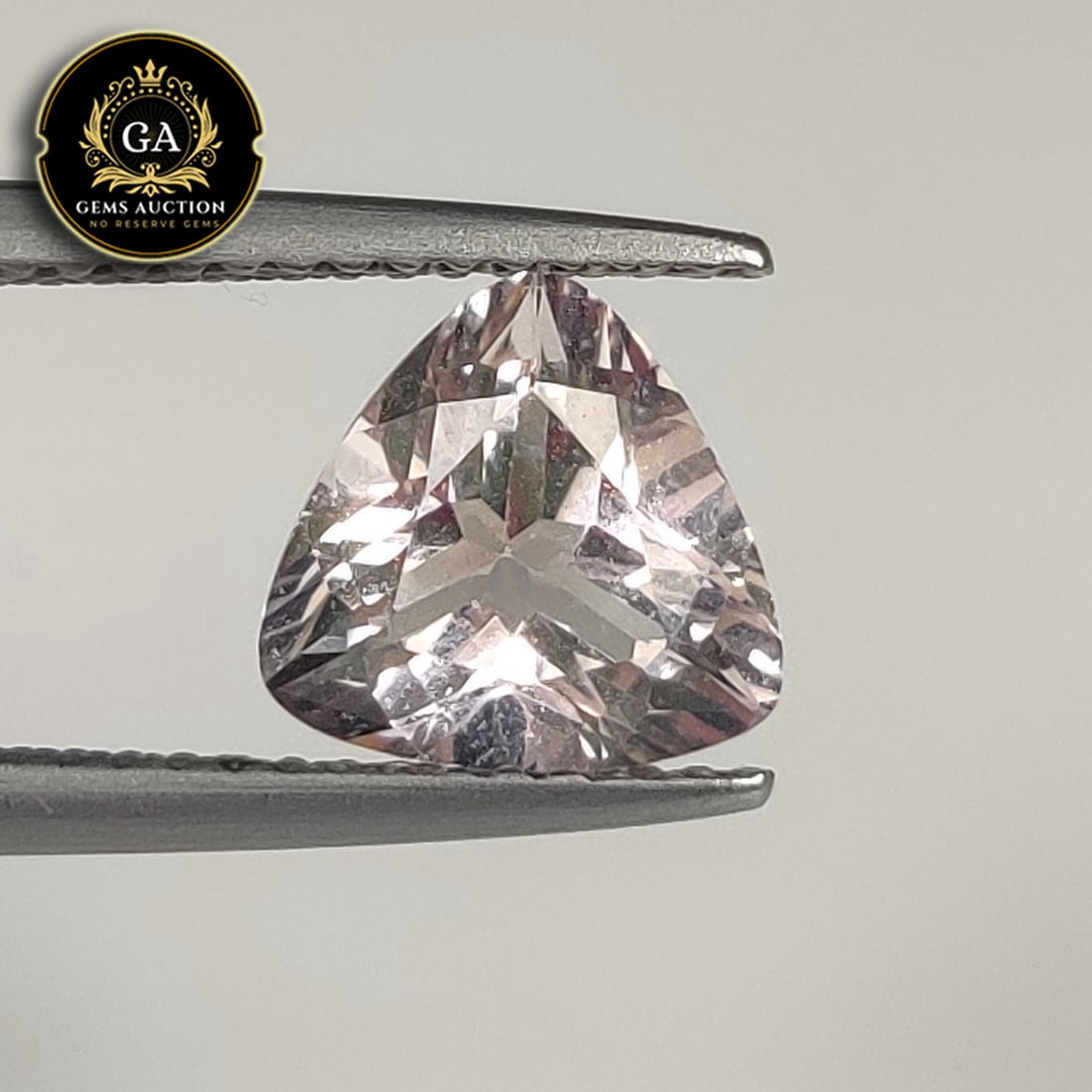1.61 Ct Natural Pleasant Pink Morganite Trillion Cut: Weight - 1.61 Ct / Size - 7.60 x 7.60 x 4.80 mm / Shape - Trillion Cut / Clarity - VVS / Origin - Brazil / Treatment - None
