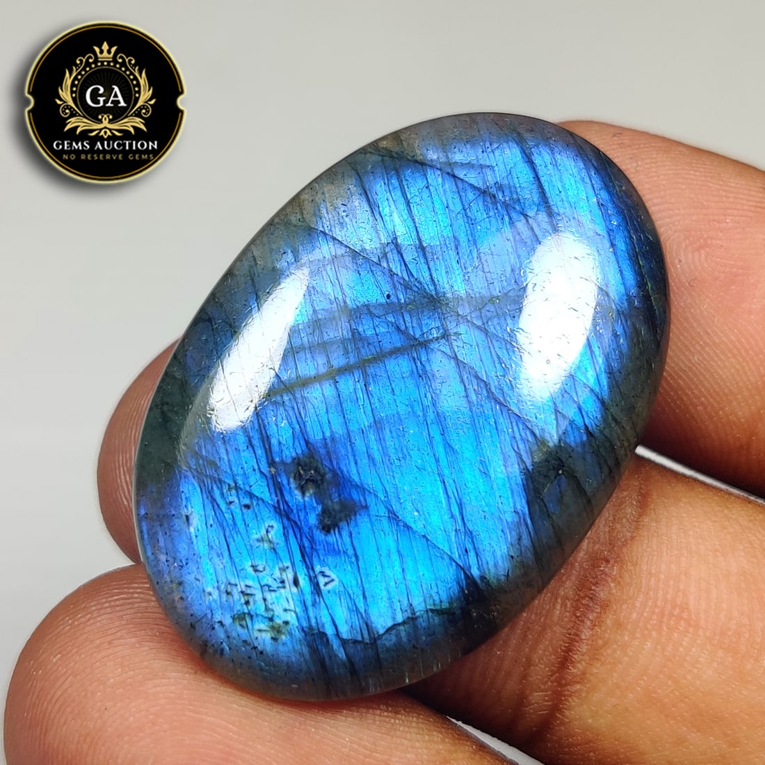 34.55 Ct Natural Blue Shaded Labradorite Oval Cab: Weight - 34.55 Ct / Size - 33.00 x 24.00 x 5.30 mm / Shape - Excellent Oval Cabochon / Clarity - Opaque / Origin - Africa / Treatment - None
