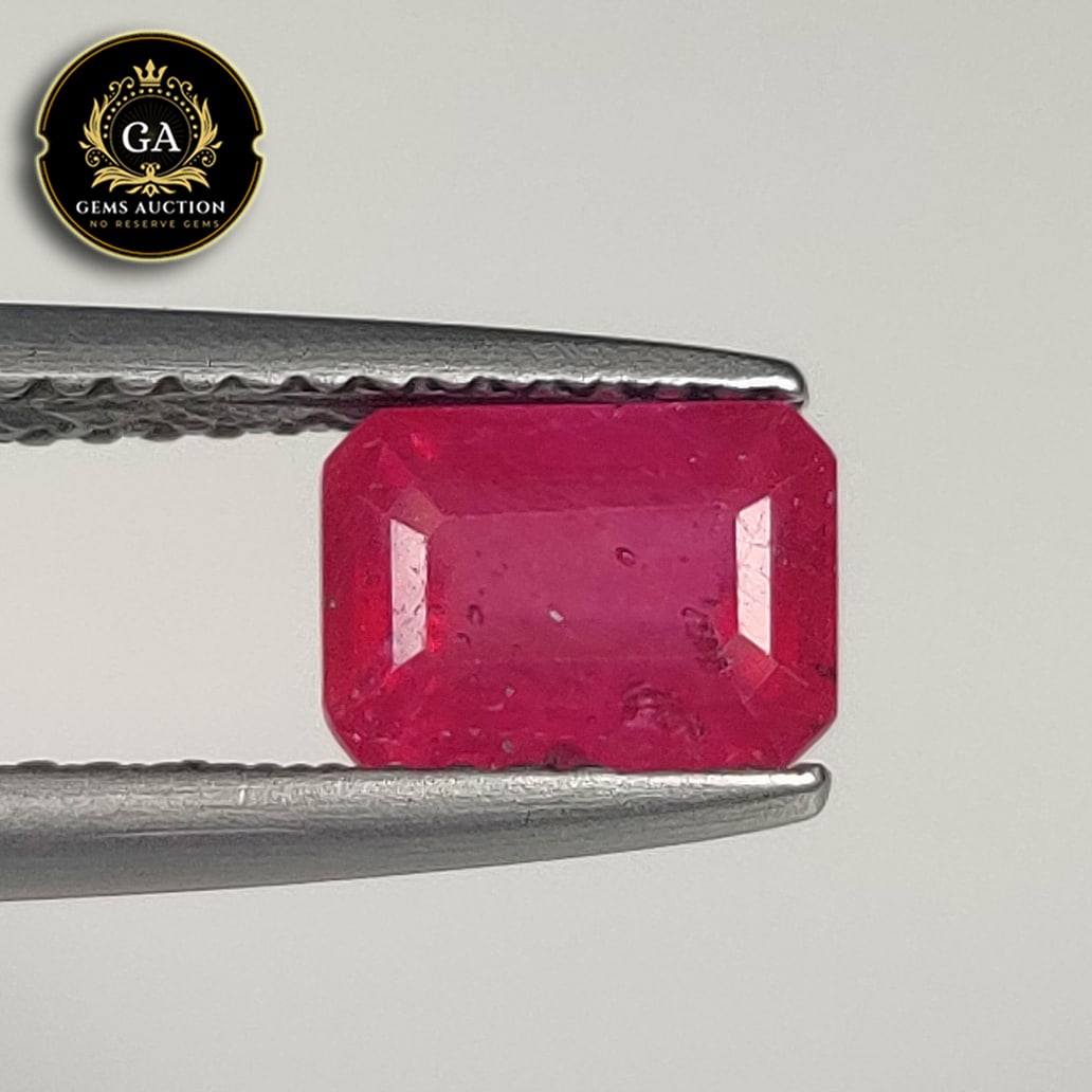 1.67 Ct Natural Pinkish Red Ruby Octagon Cut: Weight - 1.67 Ct / Size - 7.10 x 5.30 x 4.00 mm / Shape - OCtagon Cut / Color - Red / Clarity - SI / Origin - Mozambique / Treatment - Heated With Glass Filling