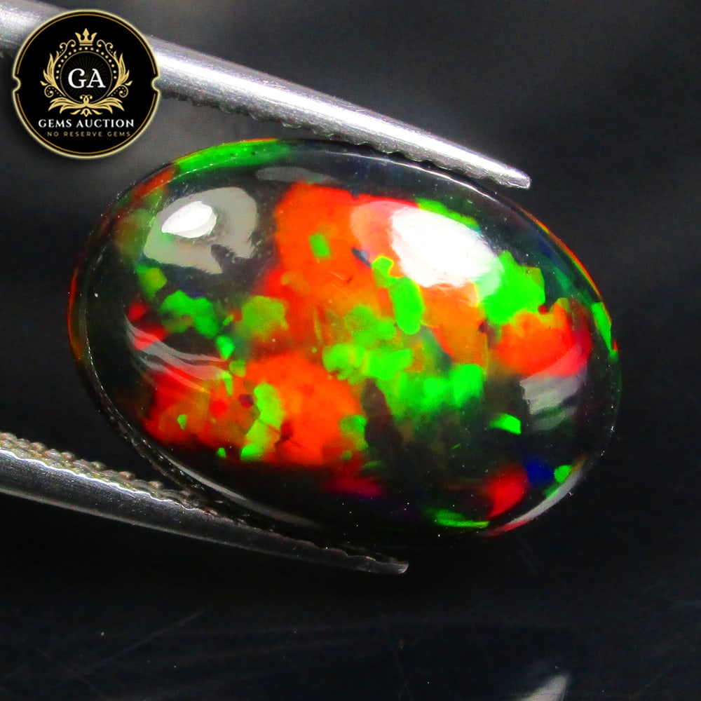 3.42 Ct Natural Black Flashing Fire Opal Oval Cab (1 of 3)