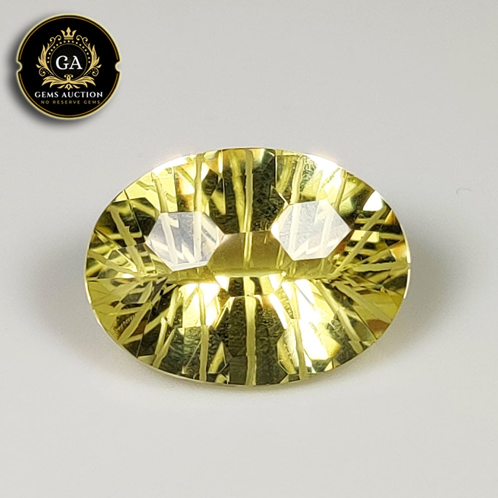 9.10 Ct Natural Lemon Quartz Oval Football Cut: Weight - 9.10 Ct / Size - 17.10 x 12.60 x 8.20 mm / Shape - Oval Football Cut / Clarity - VVS / Origin - Brazil / Treatment - None