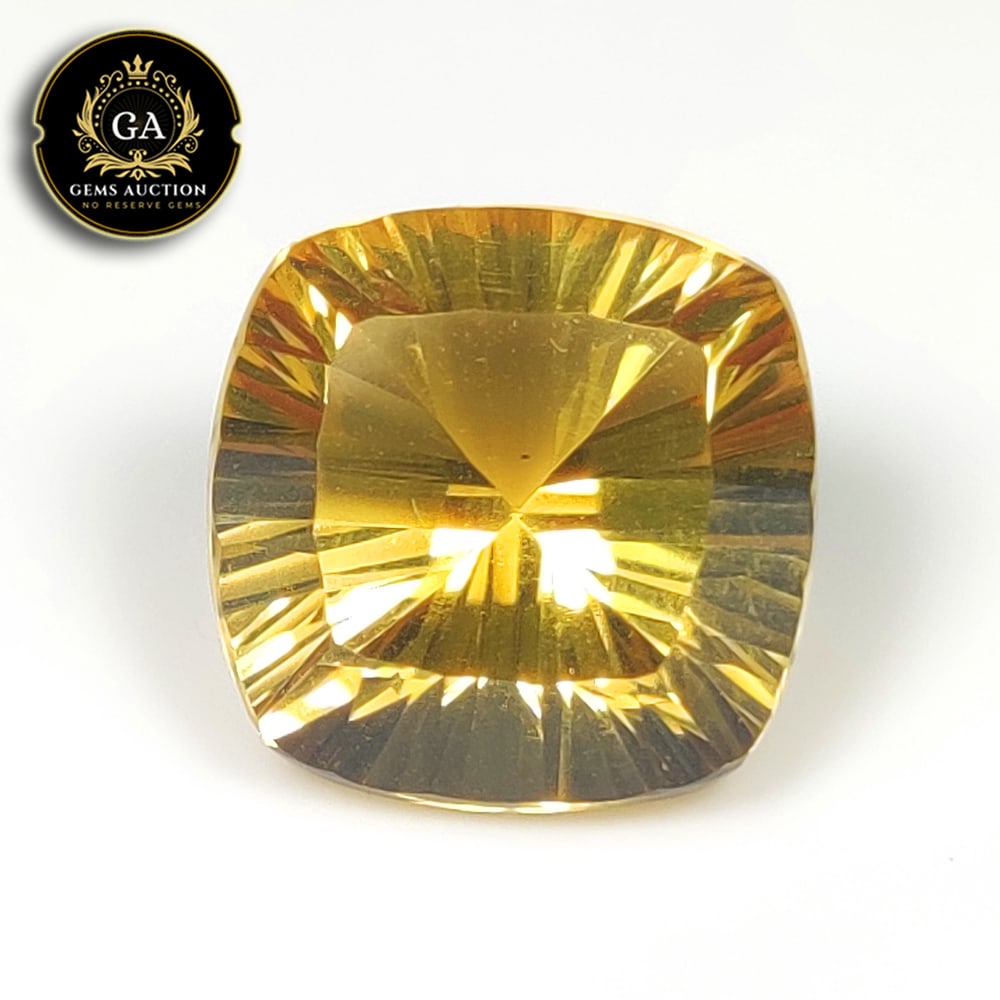 13.00 Ct Natural Yellow Citrine Cushion Concave Cut: Weight - 13.00 Ct / Size - 14.70 x 14.70 x 10.50 mm / Shape - Cushion Cut / Color - Yellow / Clarity - VVS / Origin - Brazil / Treatment - None