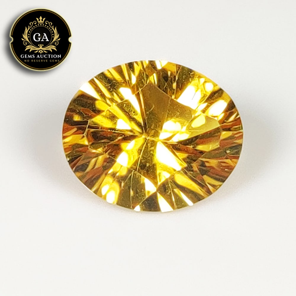 3.84 Ct Natural Citrine Oval Concave Cut: Weight - 3.84 Ct / Size - 12.00 x 10.10 x 6.40 mm / Shape - Oval Cut / Color - Yellow / Clarity - VVS / Origin - Brazil / Treatment - None