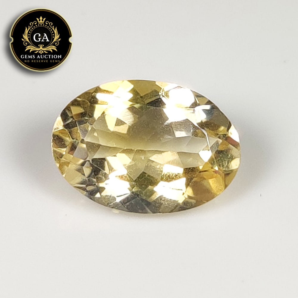 4.97 Ct Natural Citrine Oval Cut: Weight - 4.97 Ct / Size - 14.00 x 9.60 x 6.50 mm / Shape - Oval Cut / Color - Yellow / Clarity - VVS / Origin - Brazil / Treatment - None