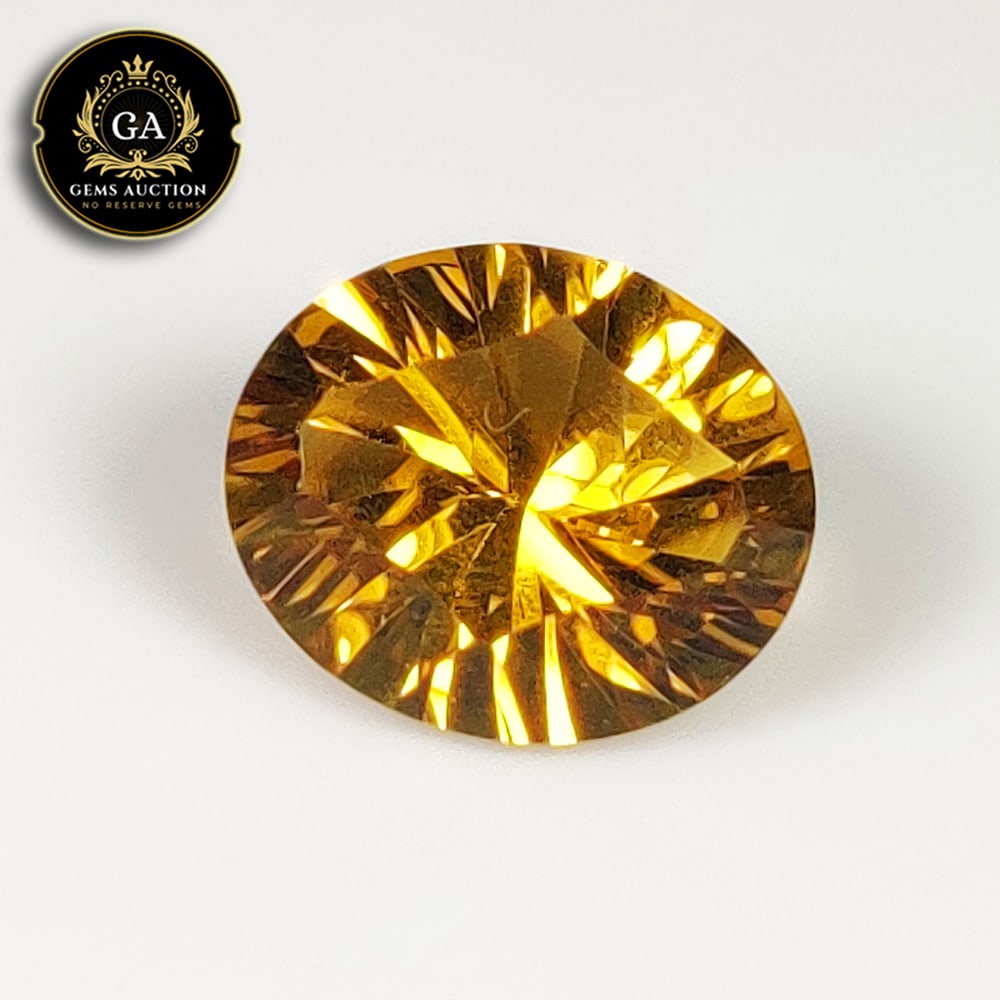 4.12 Ct Natural Citrine Oval Concave Cut: Weight - 4.12 Ct / Size - 12.20 x 10.20 x 6.80 mm / Shape - Oval Concave Cut / Color - Yellow / Clarity - VVS / Origin - Brazil / Treatment - None