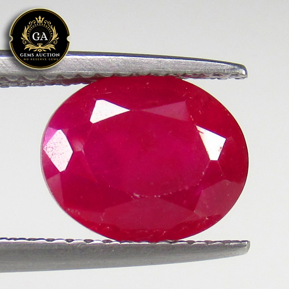 3.53 Ct Natural Pinkish Red Ruby Oval Cut: Weight - 3.53 Ct / Size - 9.80 x 8.00 x 5.00 mm / Shape - Oval Cut / Color - Pinkish Red / Clarity - SI / Origin - Mozambique / Treatment - Heated With Glass Filling