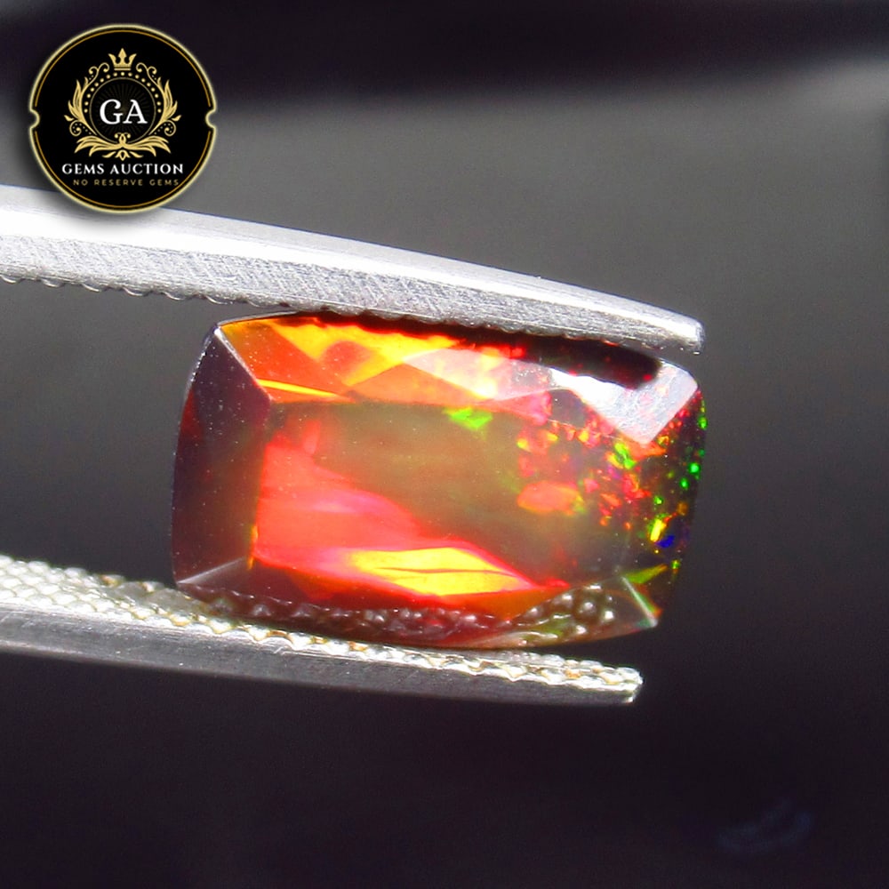 2.29 Ct Natural Black Faceted Fire Opal Cushion Cut: Weight - 2.79 Ct / Size - 11.50 x 7.50 x 5.70 mm / Shape - Cushion Cut / Color - Black / Clarity - Translucent / Origin - Ethiopia / Treatment - Heated
