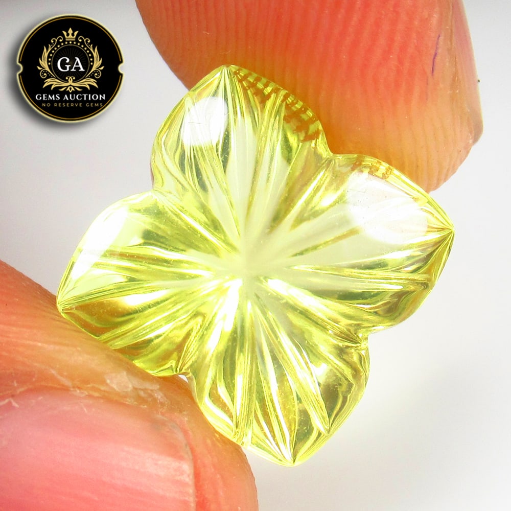 9.30 Ct Natural Lemon Quartz Fancy Flower Carving: Weight - 9.30 Ct / Size - 17.00 x 13.00 x 8.70 mm / Shape - Fancy Flower Carving / Clarity - VVS / Origin - Brazil / Treatment - None