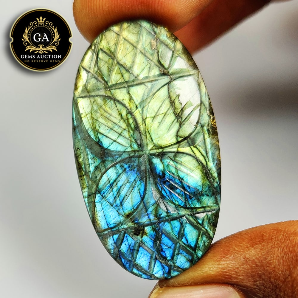53.50 Ct Natural Labradorite Oval Art Carving Cab: Weight - 53.50 Ct / Size - 39.00 x 22.00 x 7.20 mm / Shape - Excellent Oval Cab / Clarity - Opaque / Origin - Africa / Treatment - None