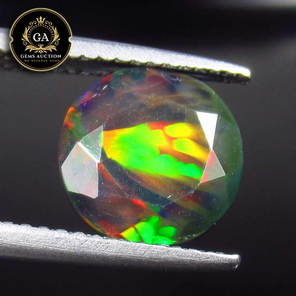 1.79 Ct Natural Black Faceted Fire Opal Round Cut: Weight - 1.79 Ct / Size - 9.50 x 9.50 x 5.00 mm / Shape - Round Cut / Color - Black / Clarity - Translucent / Origin - Ethiopia / Treatment - Heated