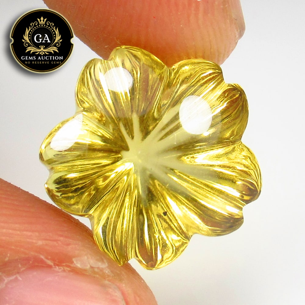 11.79 Ct Natural Citrine Fancy Flower Carving: Weight - 11.79 Ct / Size -14.70 x 14.70 x 11.50 mm / Shape - Fancy Flower Carving / Color - Yellow / Clarity - VVS / Origin - Brazil / Treatment - None