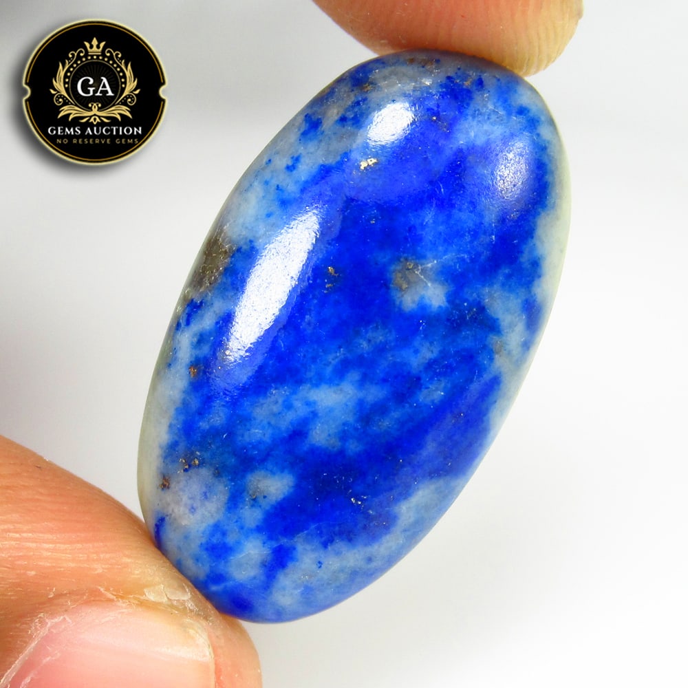 27.83 Ct Natural Blue Lapis Lazuli Oval Cab: Weight - 27.83 Ct / Size - 30.00 x 16.80 x 7.00 mm / Shape - Oval Cab / Clarity - Opaque / Origin - Ethiopia / Treatment - None