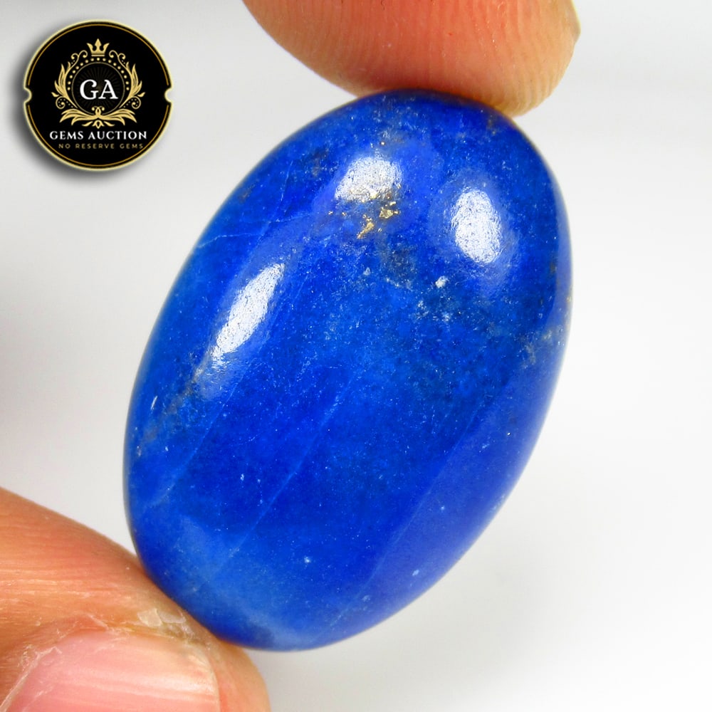 24.81 Ct Natural Blue Lapis Lazuli Oval Cab: Weight - 24.81 Ct / Size - 28.00 x 18.00 x 6.00 mm / Shape - Oval Cab / Clarity - Opaque / Origin - Ethiopia / Treatment - None