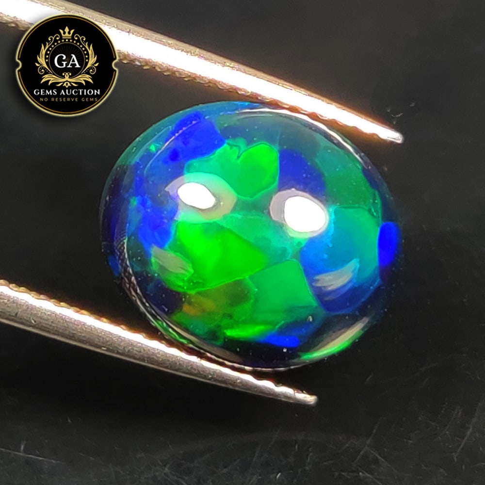 4.33 Ct Natural Black Flashing Fire Opal Oval Cab (1 of 3)