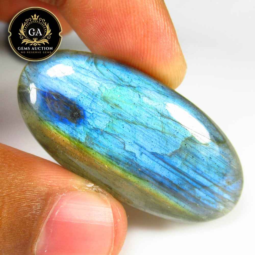 49.14 Ct Natural Blue Shaded Labradorite Oval Cab: Weight - 49.14 Ct / Size - 43.00 x 21.00 x 6.30 mm / Shape - Excellent Oval Cab / Clarity - Opaque / Origin - Africa / Treatment - None