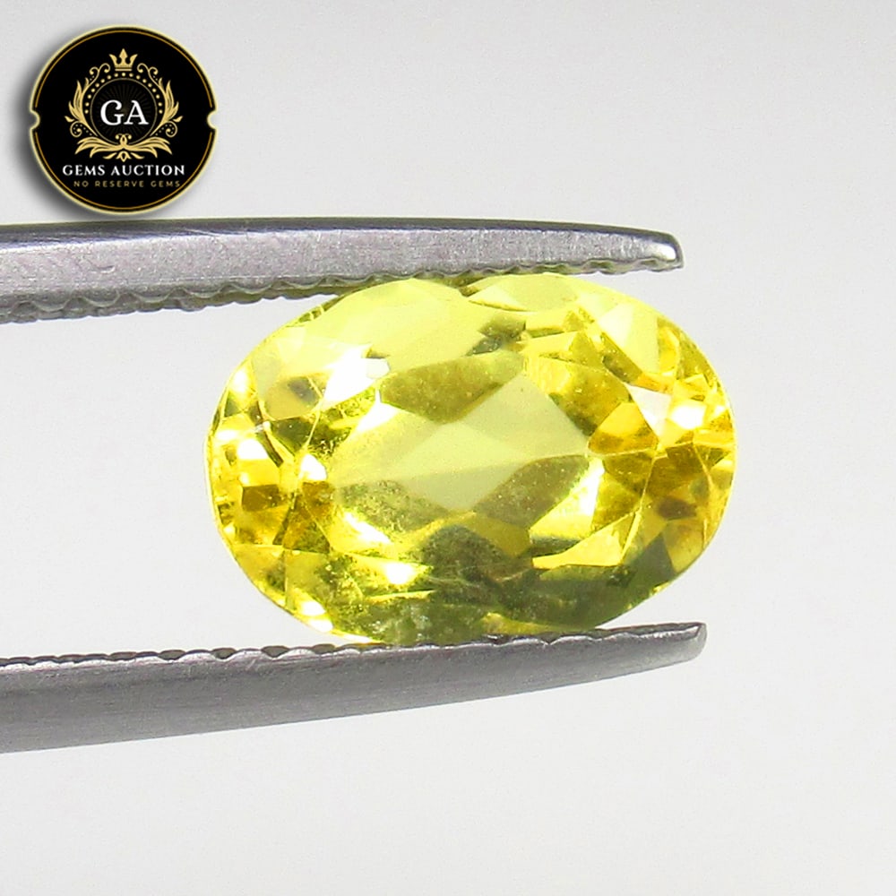 1.81 Ct Natural Yellow Beryl OVal Cut: Weight - 1.81 Ct / Size - 9.30 x 6.50 x 5.00 mm / Shape - Oval Cut / Color - Yellow / Clarity - VVS / Origin - Brazil / Treatment - None