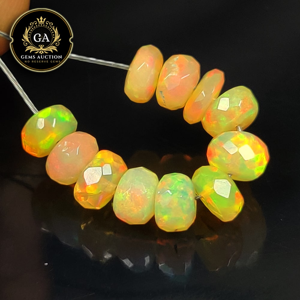 4.44 Ct Natural Drilled Multi-color Fire Opal Round Beads: Weight - 4.44 Ct / Size - 5.40 - 5.60 mm / Pieces - 11 No's / Shape -Round Beads / Color - Multicolor / Clarity - Transparent / Origin - Ethiopia / Treatment - None