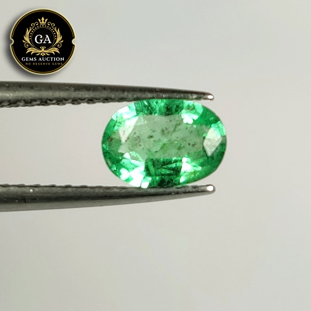 0.58 Ct Natural Zambian Emerald Oval Cut: Weight - 0.58 Ct / Size - 7.00 x 5.00 x 2.80 mm / Shape - Oval Cut / Color - Green / Clarity - SI / Origin - Zambia / Treatment - Colorless Oil