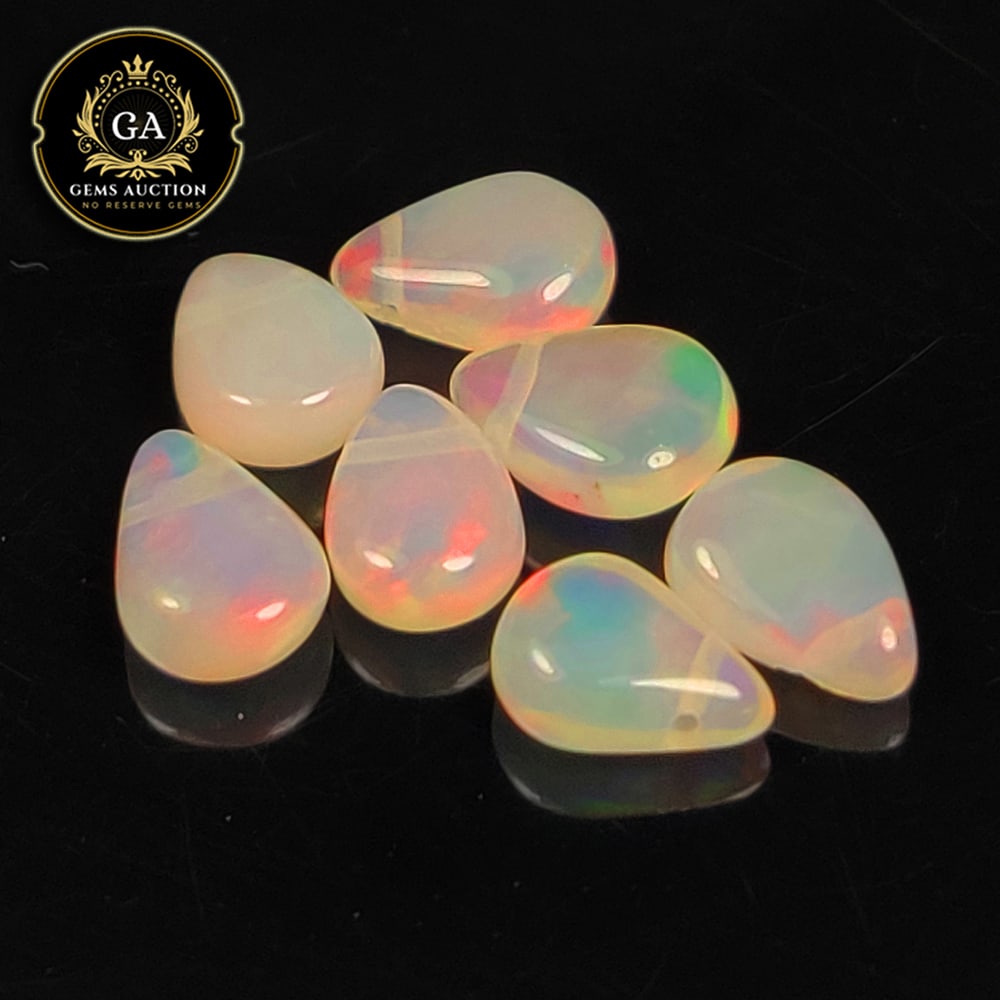 2.90 Ct Natural Multicolor Welo Opal Top Fire Pear Beads: Weight - 2.90 Ct / Size - 6.3x4.9 - 6.6x5.0 mm / 7 Pc's / Shape - Pear Beads / Color - Multicolor / Clarity - Translucent / Origin - Ethiopia / Treatment - None