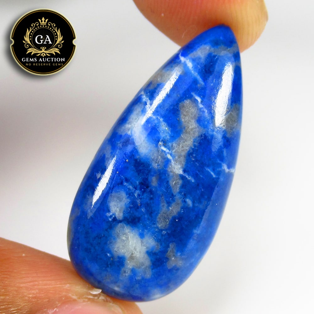 20.97 Ct Natural Blue Lapis Lazuli Pear Cab: Weight - 20.97 Ct / Size - 31.00 x 15.00 x 5.30 mm / Shape - Pear Cab / Clarity - Opaque / Origin - Ethiopia / Treatment - None