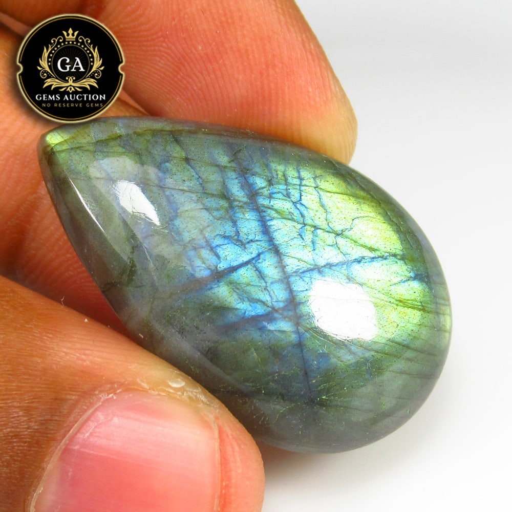 44.47 Ct Natural Blue Shaded Labradorite Pear Cab: Weight - 44.47 Ct / Size -35.00 x 21.00 x 7.30 mm / Shape - Excellent Pear Cab / Clarity - Opaque / Origin - Africa / Treatment - None
