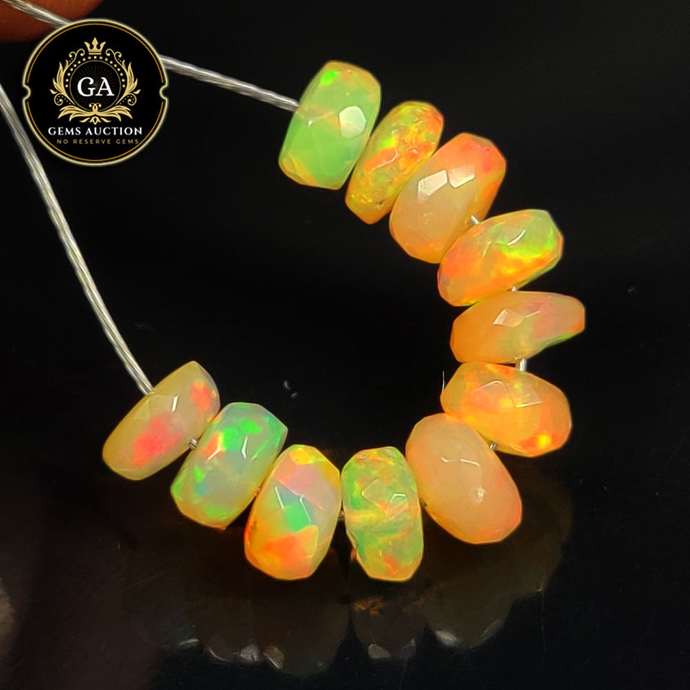 3.86 Ct Natural Drilled Multi-color Fire Opal Round Beads: Weight - 3.86 Ct / Size - 5.40 - 5.70 mm / Pieces - 11 No's / Shape -Round Beads / Color - Multicolor / Clarity - Transparent / Origin - Ethiopia / Treatment - None