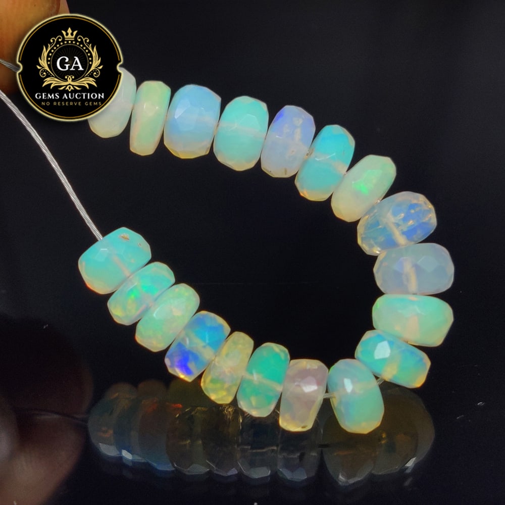 6.94 Ct Natural Drilled Multi-color Fire Opal Round Beads: Weight - 6.94 Ct / Size - 5.10 - 5.40 mm / Pieces - 19 No's / Shape -Round Beads / Color - Multicolor / Clarity - Transparent / Origin - Ethiopia / Treatment - None