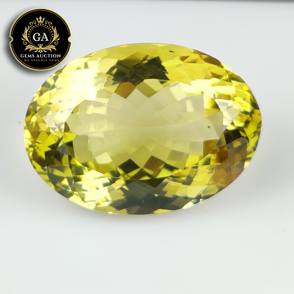 31.69 Ct Natural Clean Lemon Quartz Oval Cut: Weight - 31.69 Ct / Size - 26.10 x 18.00 x 12.40 mm / Shape - Oval Faceted Cut / Clarity - VVS / Origin - Brazil / Treatment - Heated