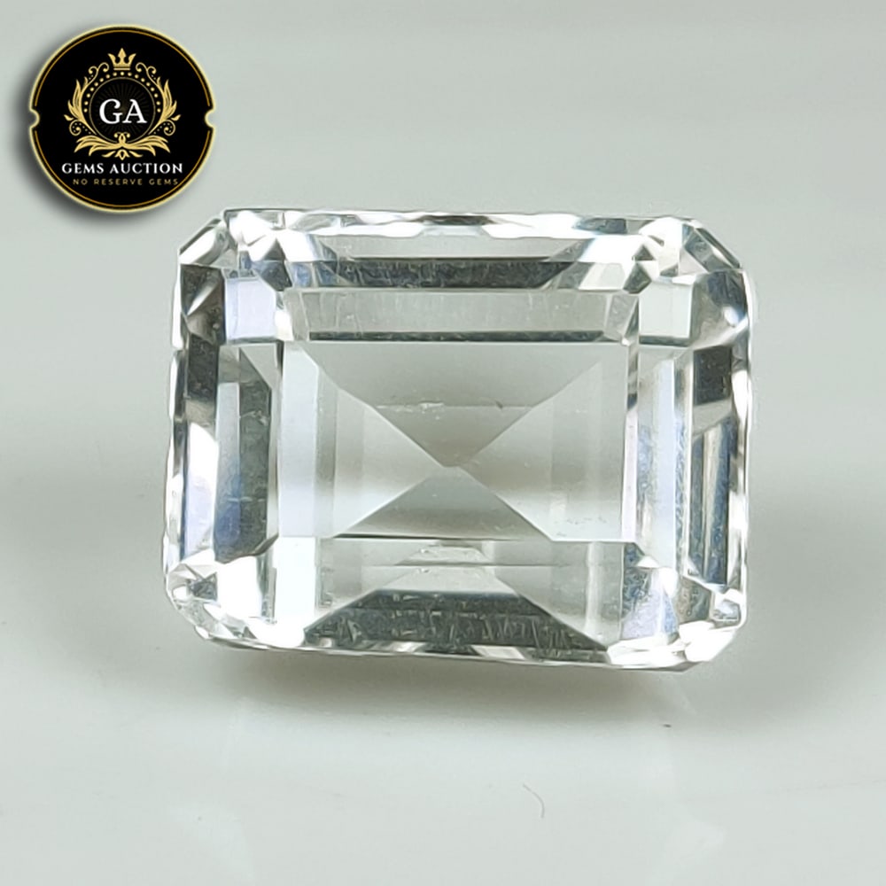 CERTIFIED 25.48 Ct Natural Colorless Quartz Emerald Cut: Weight - 25.48 Ct / Dimensions - 18.2 x 14.5 x 12.4mm / Shape & Cut - Emerald Cut / Color - Colorless / Transparency - Transparent / Comments - Unheated