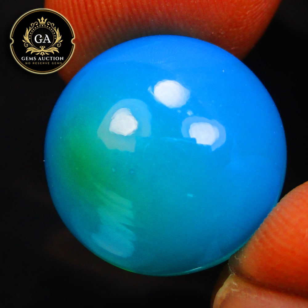 10.66 Ct Natural Blue Fire Opal Round Cab (1 of 2)