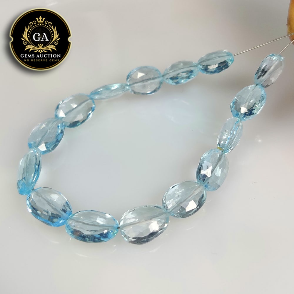 39.58 Ct Natural Blue Topaz Fancy Dumble Beads: Weight - 39.58 Ct / Size - 18.5x7.0 - 11.0x7.1 mm / 15 Pc's / 5.5" inches / Shape - Dumble Beads / Color - Blue / Clarity - VVS / Origin - Brazil / Treatment - Irradiated