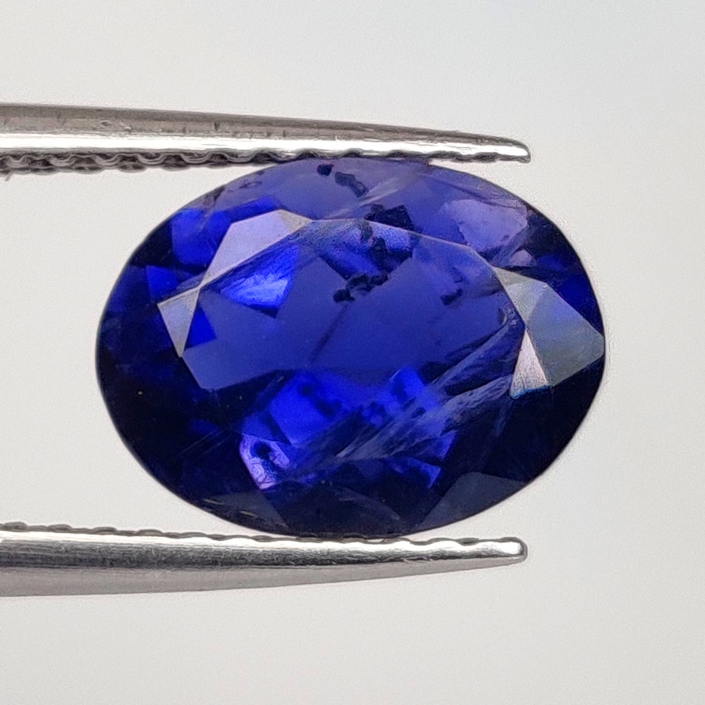 2.00 Ct Natural Violet Iolite Oval Cut: Weight - 2.00 Ct / Dimensions - 9.80 x 7.40 x 5.00 mm / Shape & Cut - Oval Cut / Color - Deep Violet / Transparency - - VVS / Origin - Nigeria / Comments - - Heated
