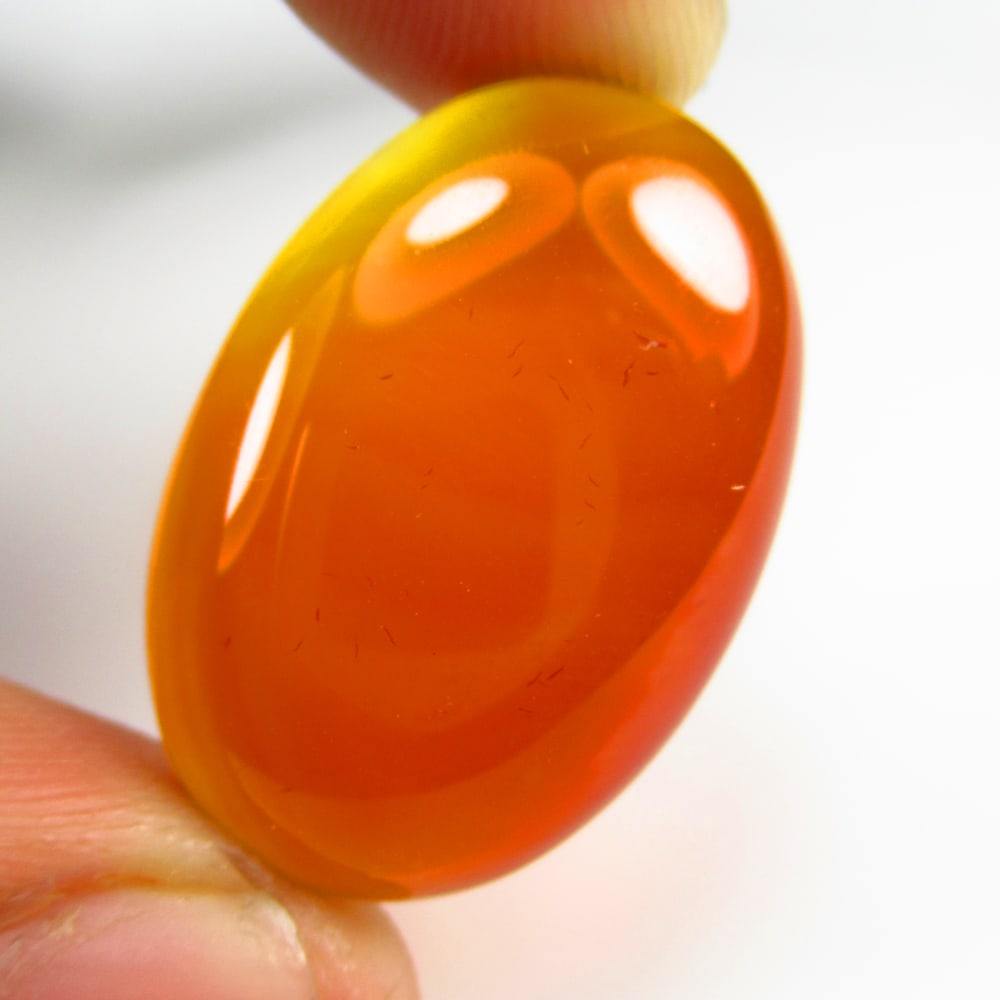 24.63 Ct Natural Orange Onyx Oval Cab: Weight - 24.63 Ct / Dimensions - 28.00 x 18.30 x 6.00 mm / Shape & Cut - Oval Cab / Transparency - Semi Transparent / Origin - Brazil / Comments - None