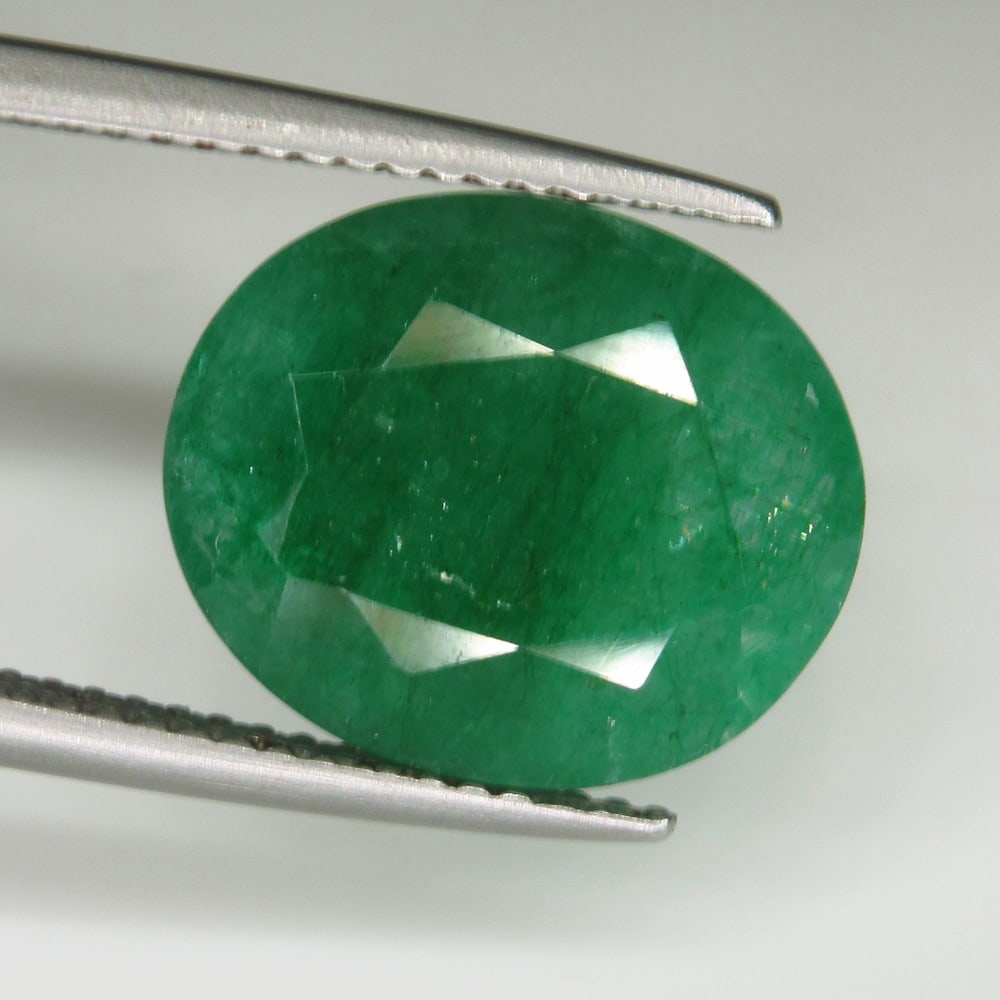 6.94 Ct Natural Green Emerald Oval Cut: Weight - 6.94 Ct / Dimensions - 13.80 x 11.60 x 6.00 mm / Shape & Cut - Oval Cut / Color - Green / Transparency - SI / Origin - Zambia / Comments - Color Coated
