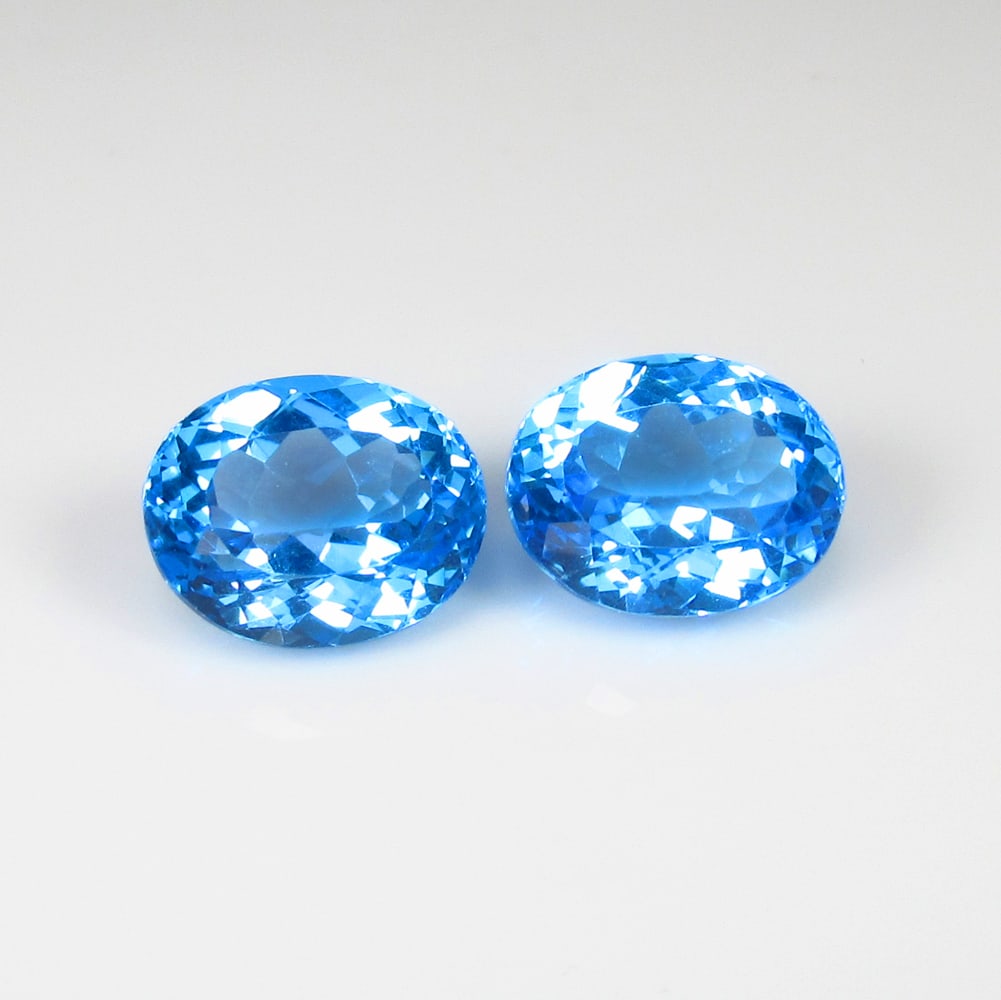 8.15 Ct Natural Blue Topaz Oval Cut Pair: Weight - 8.15 Ct / Dimensions - 10.30 x 8.50 x 6.10 mm / 2 Pc's / Shape & Cut - Oval Cut / Color - Blue / Transparency - VVS / Origin - Brazil / Comments - Irradiated