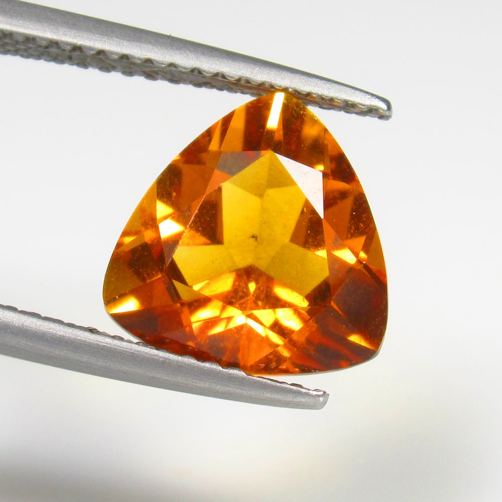 2.96 Ct Natural Premium Quality Citrine Trillion Cut: Weight - 2.96 Ct / Size -10.00 x 10.00 x 6.00 mm / Shape - Trillion Cut / Color - Yellow / Clarity - VVS / Origin - Brazil / Treatment - Heated