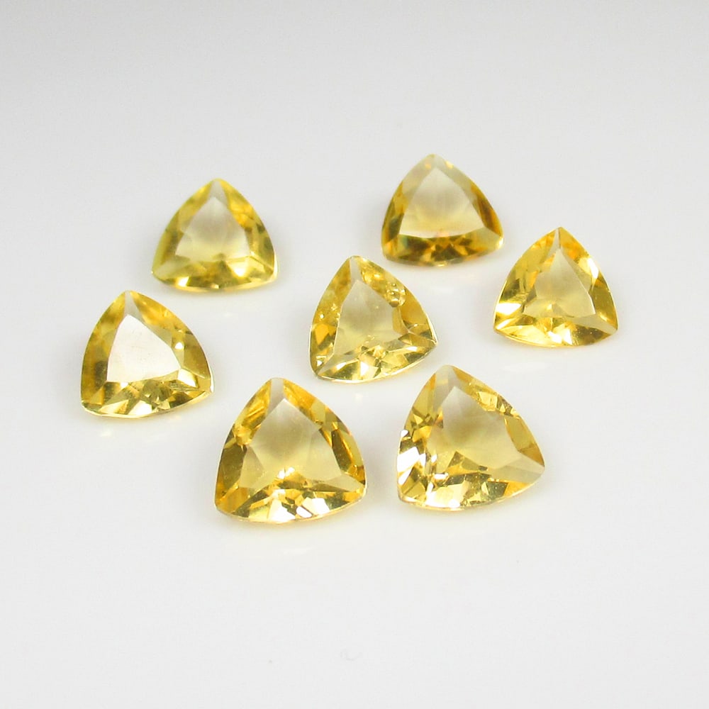 3.91 Ct Natural Citrine Trillion Cut Set: Weight - 3.91 Ct / Size - 5.6x5.6 - 6.2x6.2 mm / 7 Pc's / Shape - Trillion Cut / Color - Yellow / Clarity - VVS / Origin - Brazil / Treatment - Heated
