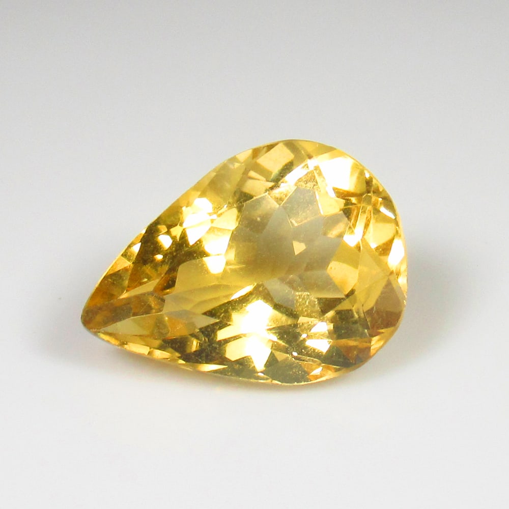 5.81 Ct Natural Citrine Pear Cut: Weight - 5.81 Ct / Size - 15.00 x 11.00 x 7.30 mm / Shape - Pear Cut / Color - Yellow / Clarity - VVS / Origin - Brazil / Treatment - Heated