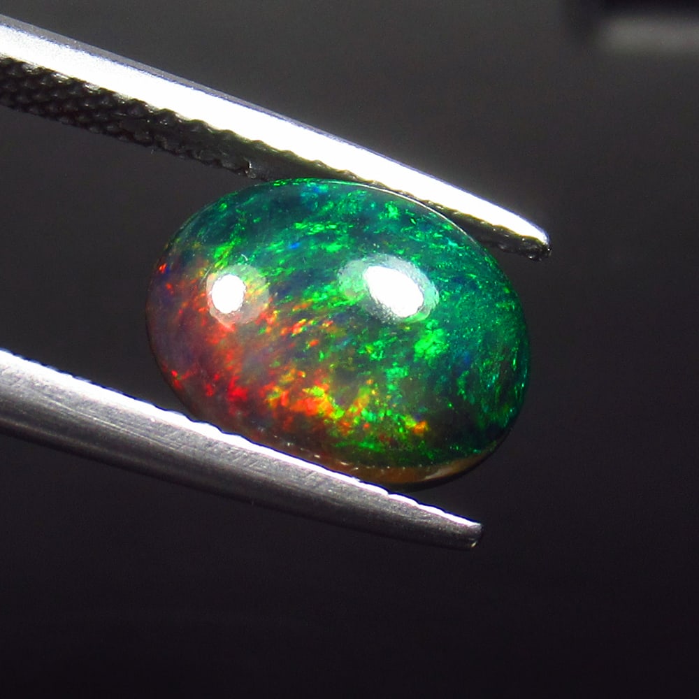 1.79 Ct Natural Black Flash Fire Opal Oval Cab (1 of 2)