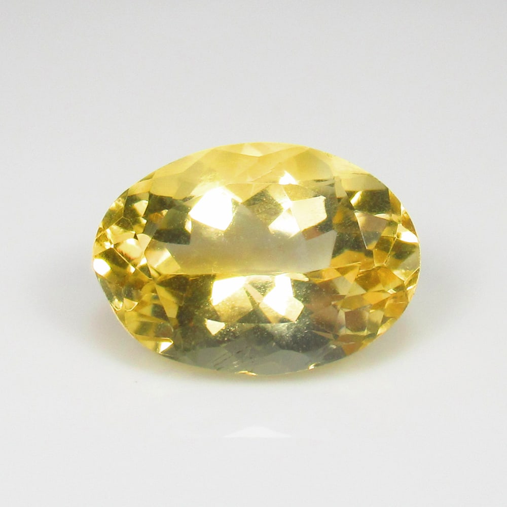 5.66 Ct Natural Yellow Citrine Oval Cut: Weight - 5.66 Ct / Size - 14.00 x 10.00 x 7.40 mm / Shape - Oval Cut / Color - Yellow / Clarity - VVS / Origin - Brazil / Treatment - Heated