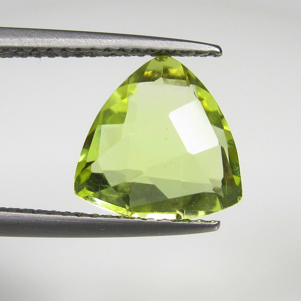 3.01 Ct Natural Lemon Quartz Trillion Cut: Weight - 3.01 Ct / Dimensions - 10.20 x 10.10 x 5.20 mm / Shape & Cut - Trillion Cut / Color - Greenish Yellow / Transparency - Transparent / Comments - Heated
