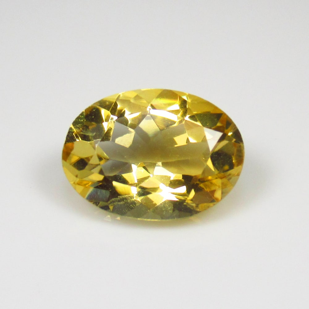 4.61 Ct Natural Yellow Citrine Oval Cut: Weight - 4.61 Ct / Size - 13.60 x 9.90 x 6.30 mm / Shape - Oval Cut / Color - Yellow / Clarity - VVS / Origin - Brazil / Treatment - Heated