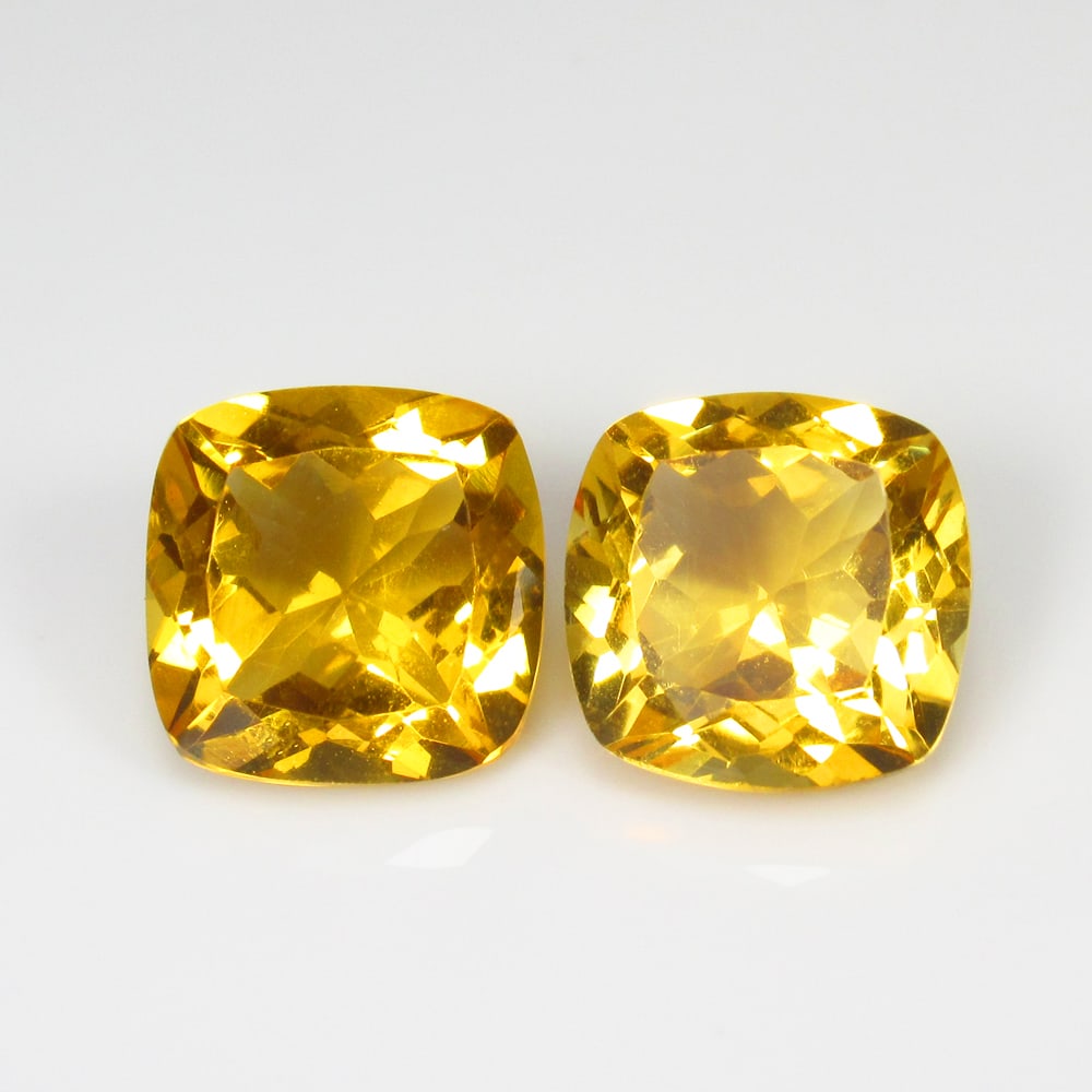 8.62 Ct Natural Yellow Citrine Cushion Cut Pair: Weight - 8.62 Ct / Dimensions - 10.20 x 10.20 x 6.70 mm / 2 Pc's / Shape - Cushion Cut / Color - Yellow / Clarity - VVS / Origin - Brazil / Treatment - Heated