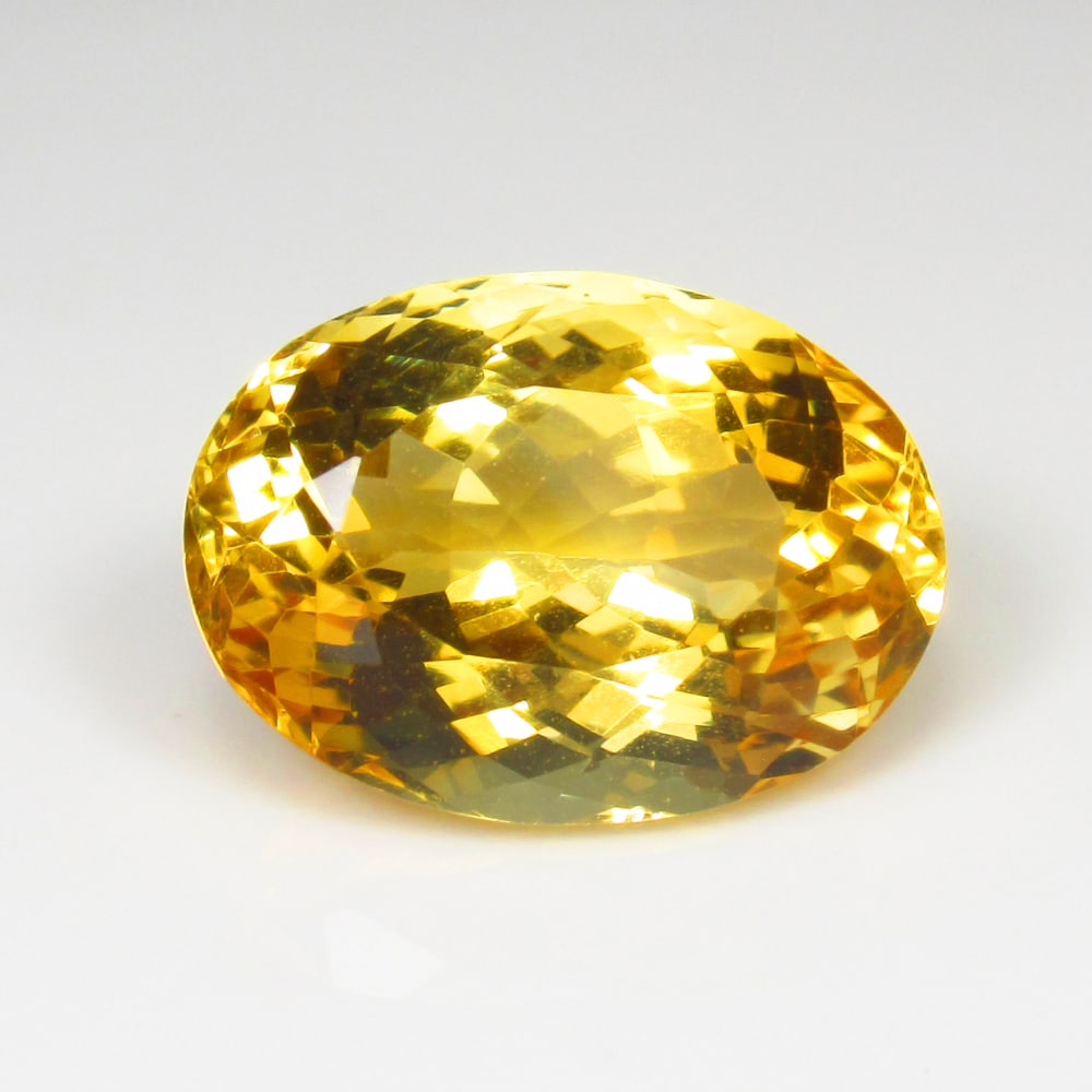 11.14 Ct Natural Yellow Citrine Oval Cut: Weight - 11.14 Ct / Dimensions - 16.70 x 12.20 x 9.60 mm / Shape - Oval Cut / Color - Yellow / Clarity - VVS / Origin - Brazil / Treatment - Heated
