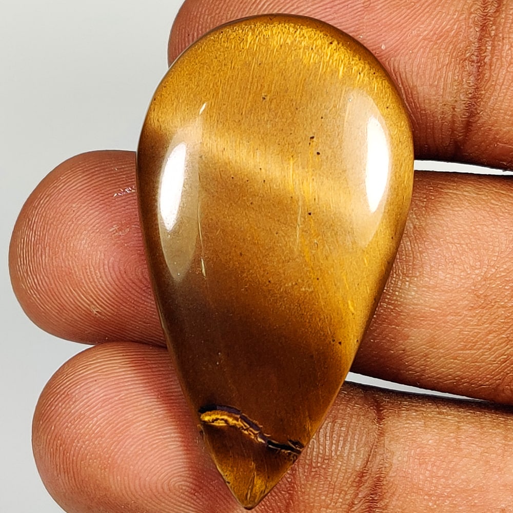 46.58 Ct Natural Tiger Eye Pear Cab (1 of 2)
