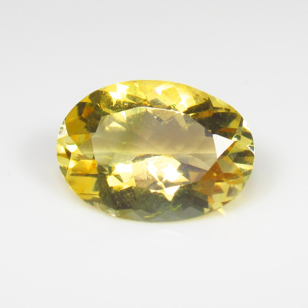 4.71 Ct Natural Yellow Citrine Oval Cut: Weight - 4.71 Ct / Dimensions - 13.90 x 10.00 x 6.40 mm / Shape - Oval Cut / Color - Yellow / Clarity - VVS / Origin - Brazil / Treatment - Heated