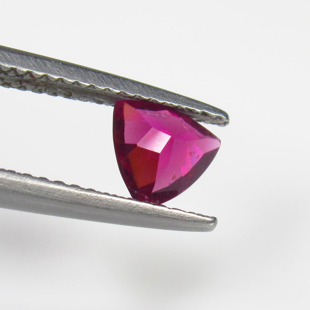 0.71 Ct Natural Almandite Garnet Trillion Cut: Weight - 0.71 Ct / Size - 6.10 x 6.10 x 2.90 mm / Shape - Trillion Cut / Clarity - VVS / Origin - Nigeria / Treatment - None