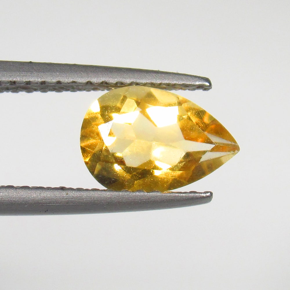 1.31 Ct Natural Yellow Citrine Pear Cut: Weight - 1.31 Ct / Size - 9.30 x 6.30 x 4.50 mm / Shape - Pear Cut / Color - Yellow / Clarity - VVS / Origin - Brazil / Treatment - Heated