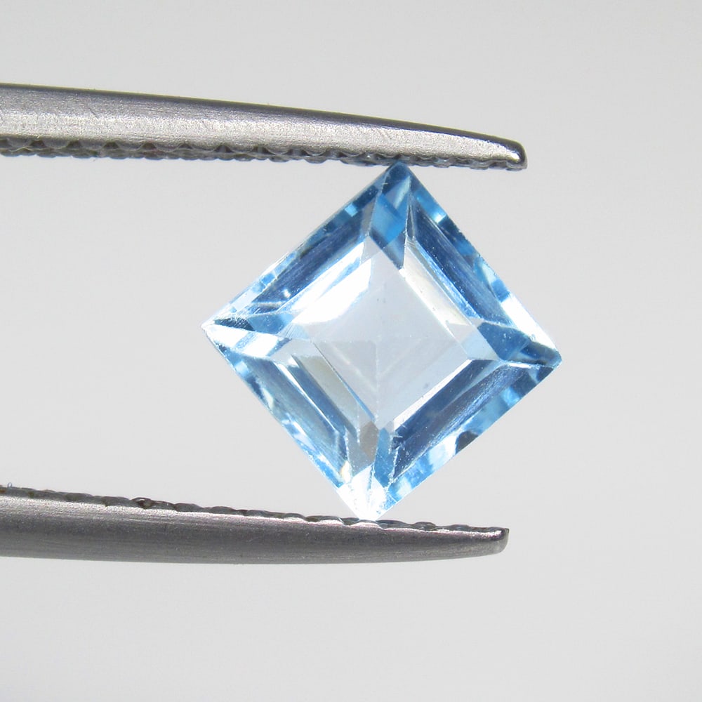 1.65 Ct Natural Blue Topaz Square Cut: Weight - 1.65 Ct / Size - 6.20 x 6.20 x 4.40 mm / Shape - Square Cut / Color - Blue / Clarity - VVS / Origin - Brazil / Treatment - Irradiated